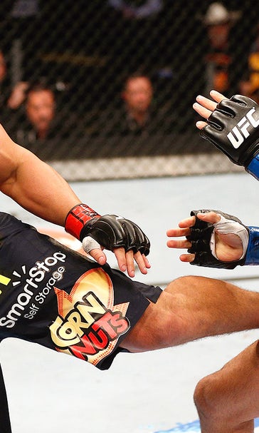 Hendricks wins UFC welterweight title in instant classic over Lawler